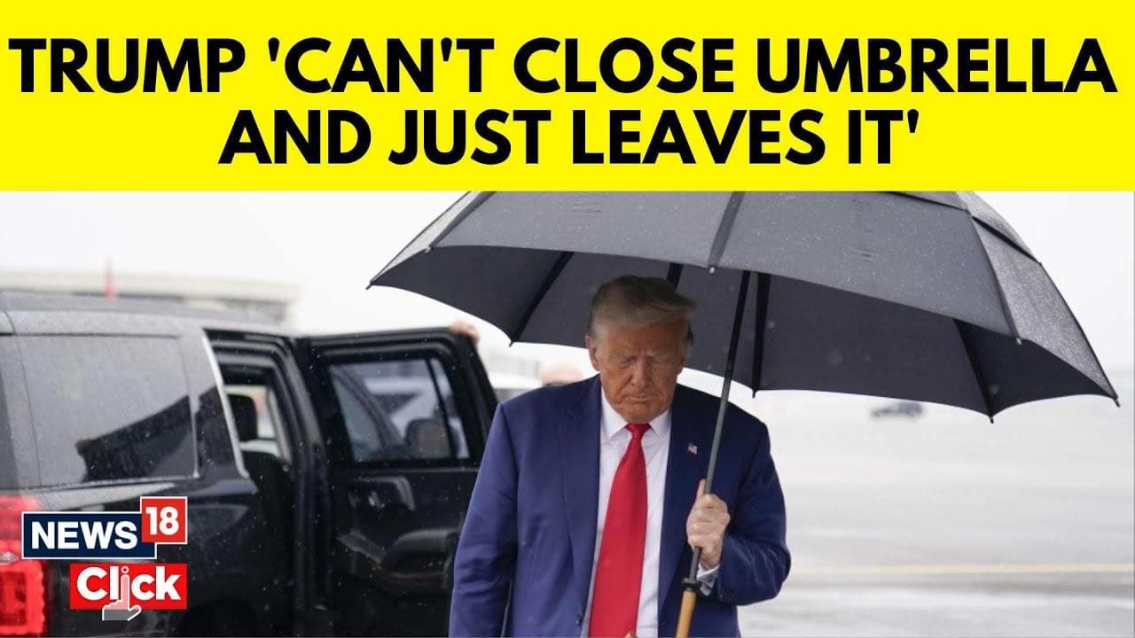 Трамп знову в центрі уваги: курйоз із парасолею при посадці на борт літака